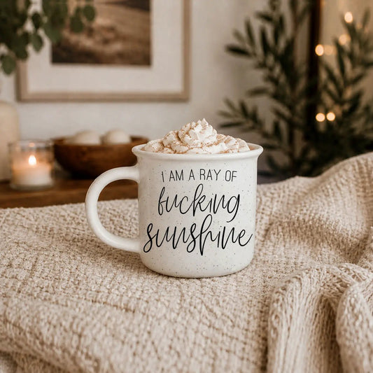 Ray of F'n Sunshine mug by Gia Roma, speckled white ceramic with whipped cream topping on Tampa Home & Garden Store