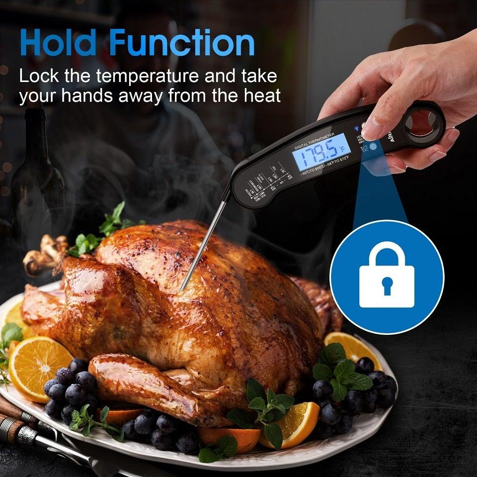 Digital thermometer with backlit display inserted into turkey on platter with hold function on Tampa Home & Garden Store