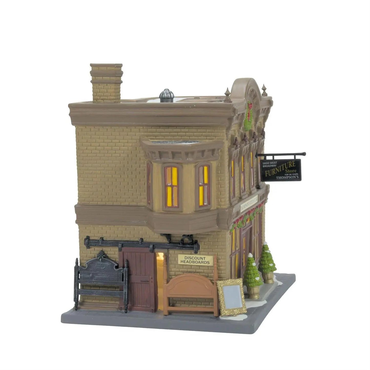 Thompson's Headboard Collection Christmas City village storefront beige brick with warm windows on Tampa Home & Garden Store