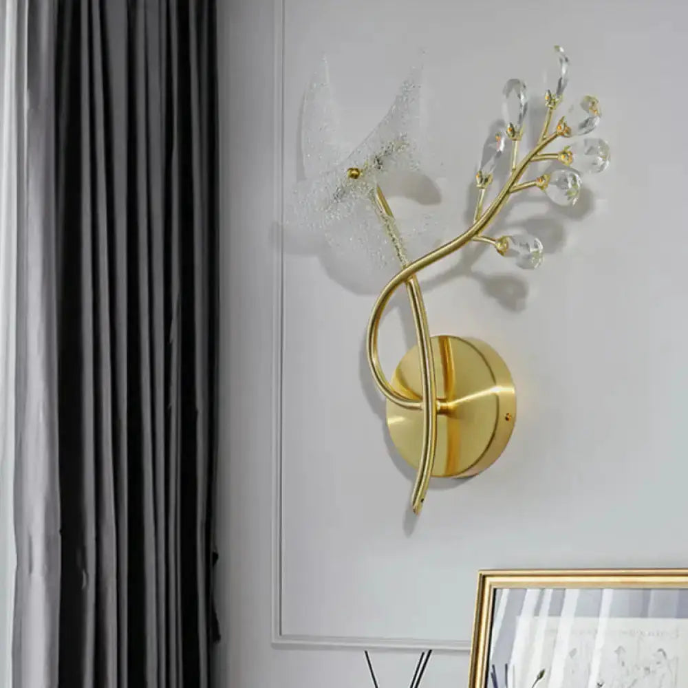 Gold dual-head wall sconce with faceted crystal drops and brass branches by Decorbites on Tampa Home & Garden Store