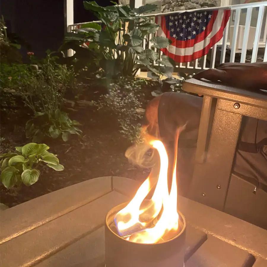 Outdoor Party Box with City Bonfires candles on a metal fire cylinder atop a patio table on Tampa Home & Garden Store