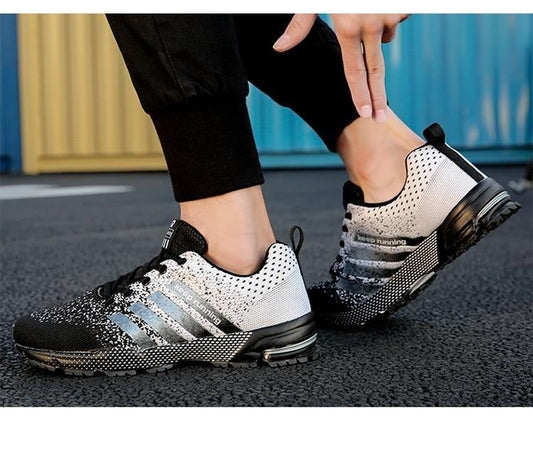 Stevvex men's running sneakers with breathable gray mesh upper and cushioned sole pair on Tampa Home & Garden Store