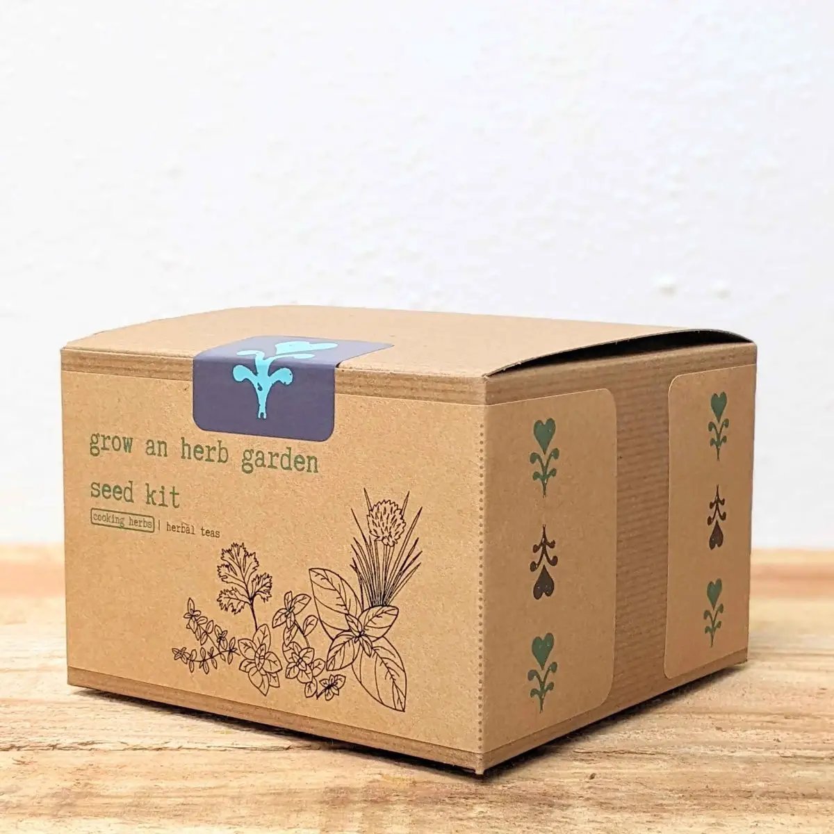 Herb seed kit box in brown craft with botanical illustrations and a purple label on Tampa Home & Garden Store