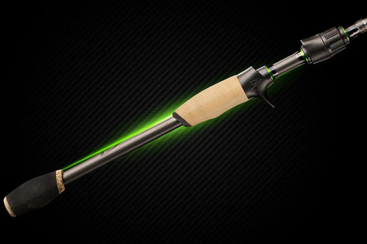 Gunner Series freshwater spinning rod by Denali with cork handle and neon green accents on carbon backdrop on Tampa Home & Garden Store