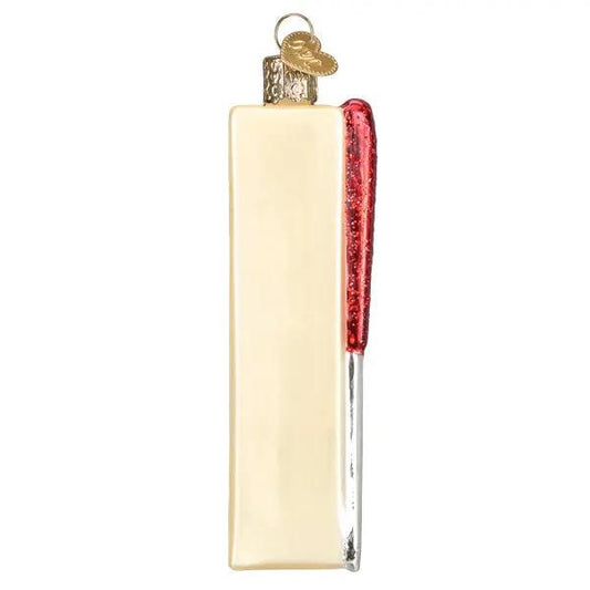 Stick of Butter glass Christmas ornament with cream body and red glitter accent, gold cap on Tampa Home & Garden Store