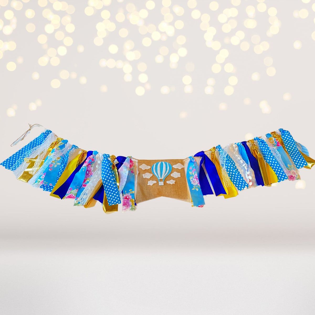 Hot Air Balloon Banner garland with blue and gold ribbons on Tampa Home & Garden Store