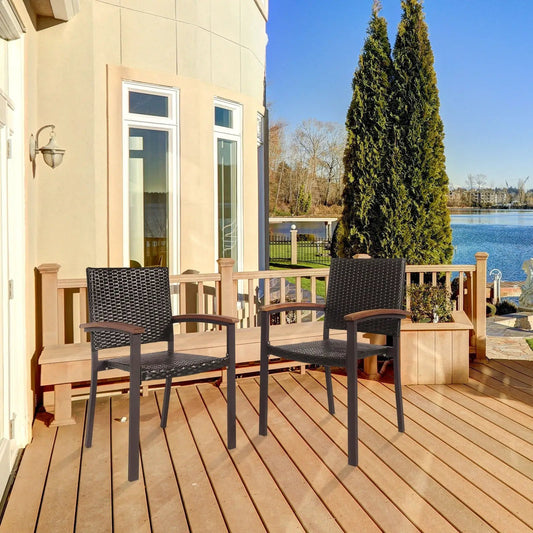 Set of 2 PE rattan dining chairs in black on a wooden deck with lake view on Tampa Home & Garden Store