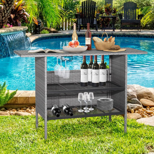 Outdoor patio wicker bar table with metal shelves by pool, stocked with wine bottles and glasses on Tampa Home & Garden Store