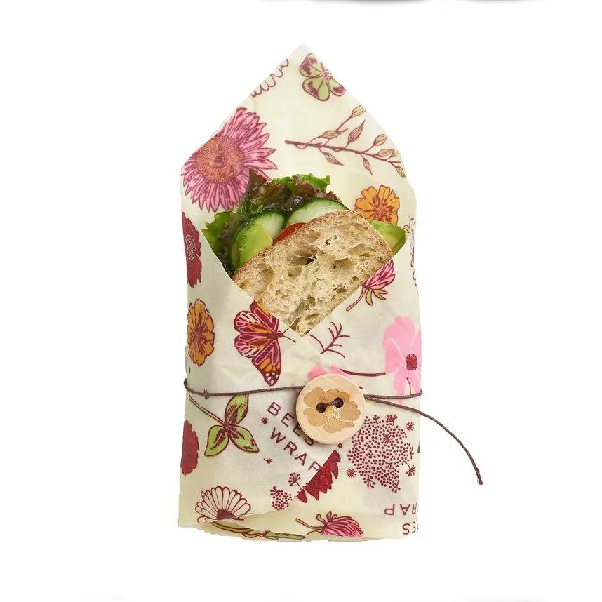 Bee's Wrap Meadow Magic Print vegan sandwich wrap, floral pattern with wooden button closure on Tampa Home & Garden Store