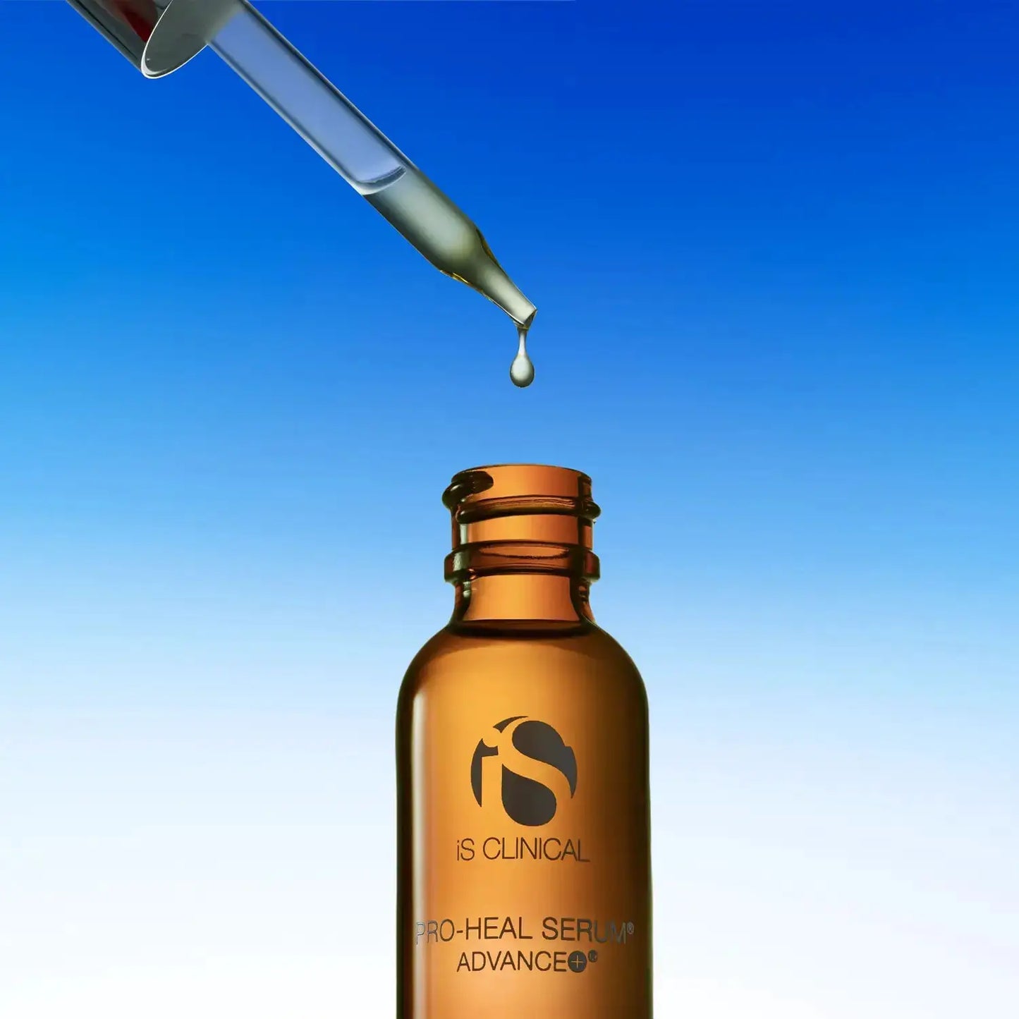 iS Clinical PRO-HEAL SERUM ADVANCE+ amber glass serum bottle with dropper against blue sky on Tampa Home & Garden Store