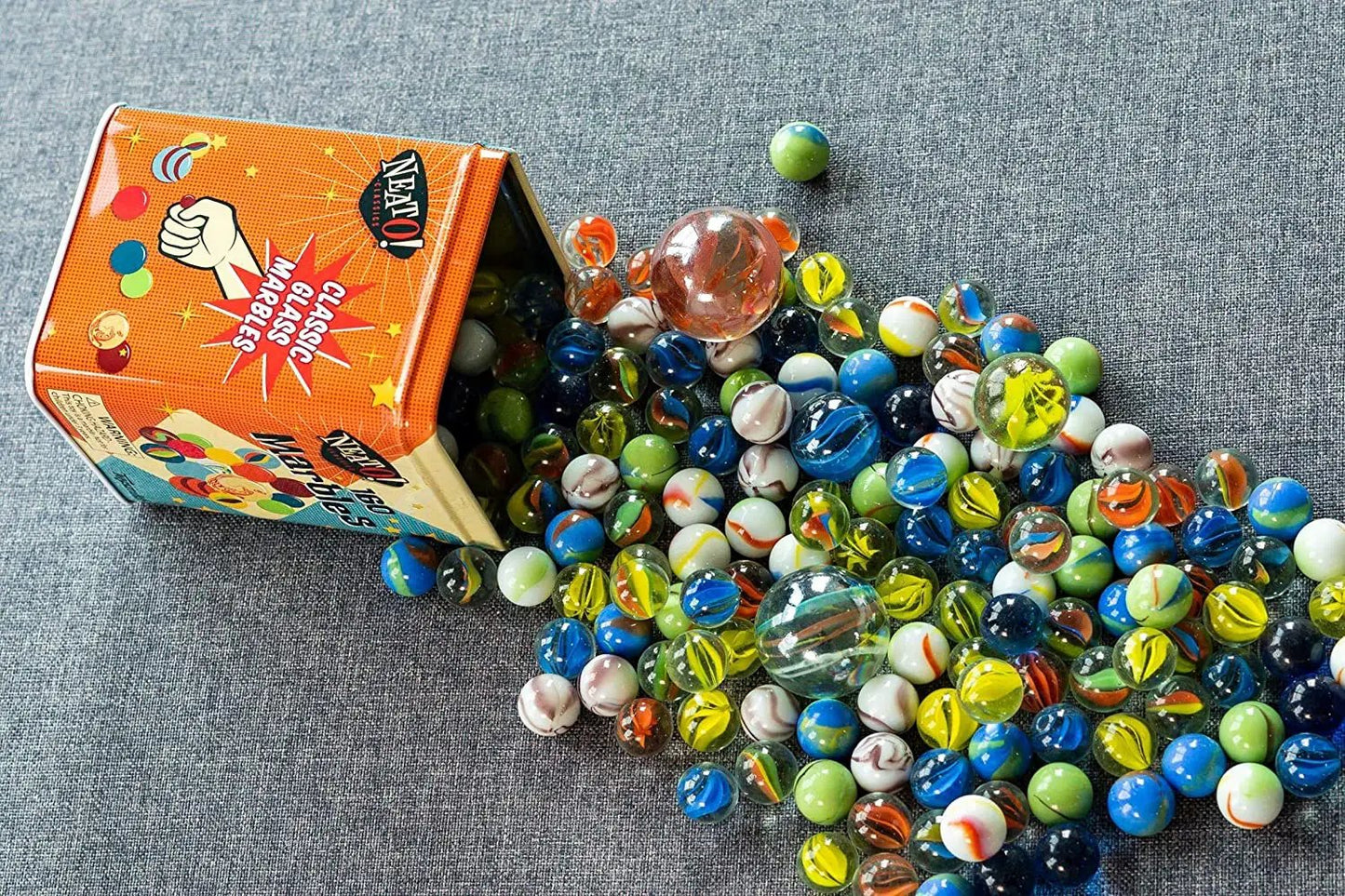 Neato Marbles in a Tin Box set of 160 with colorful glass marbles spilling from an orange tin on Tampa Home & Garden Store