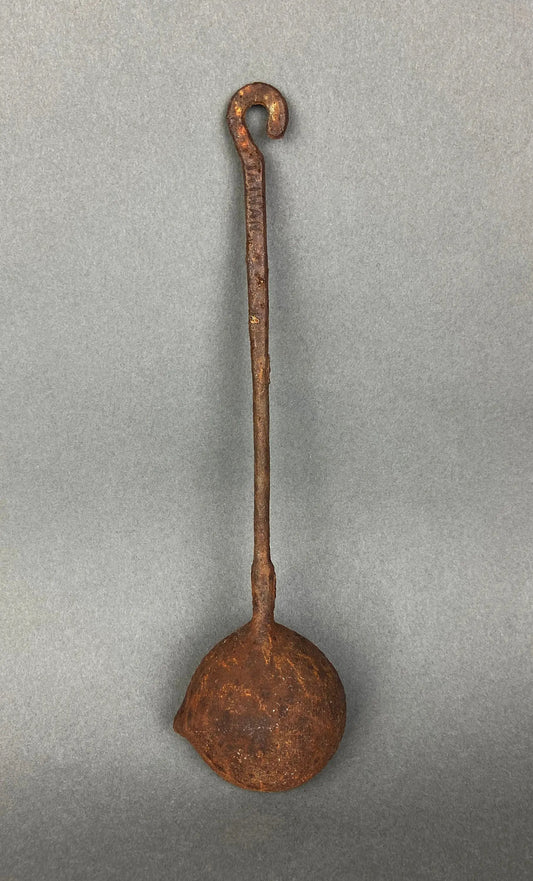 Rusty vintage iron ladle with long straight handle and curved hook, round bowl decor on Tampa Home & Garden Store