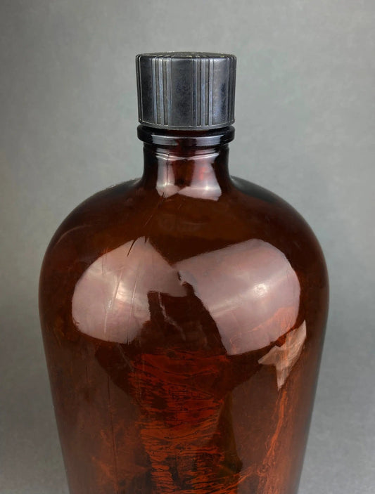 Vintage extra-large amber glass apothecary bottle decorative jar with ribbed gray metal cap on Tampa Home & Garden Store