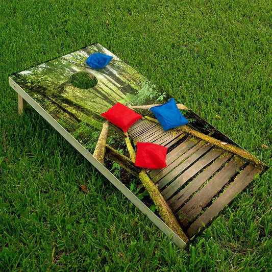Misty Rainforest Cornhole Board Wrap Set 2 forest mural and hole cutout, red and blue bean bags on Tampa Home & Garden Store