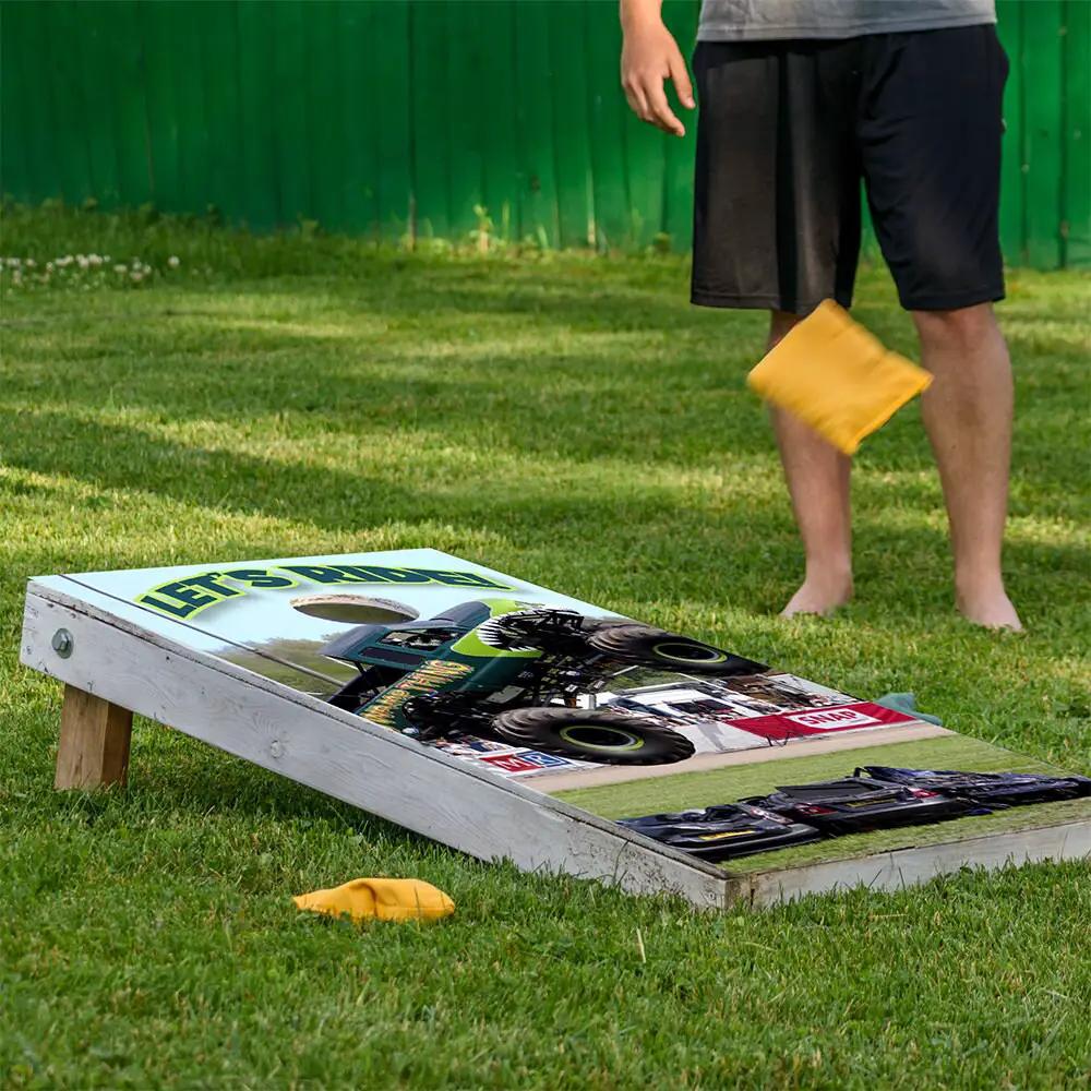 Monster Truck Cornhole Board Wraps set of 2 with truck graphics on white boards on Tampa Home & Garden Store