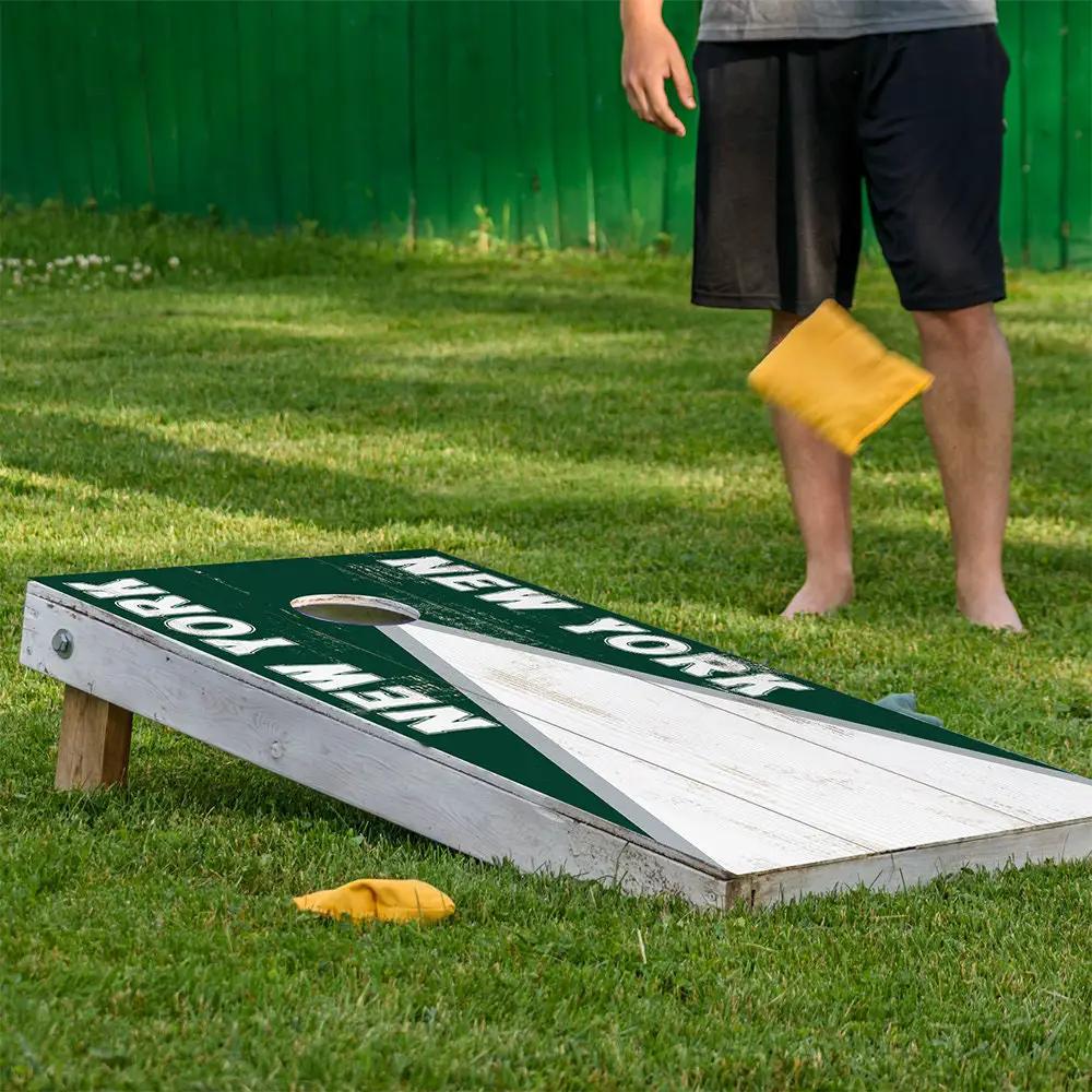 New York Green White Football Cornhole Board Wrap with dark green playing surface on Tampa Home & Garden Store