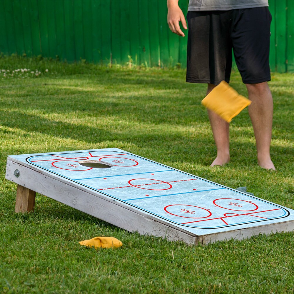 Hockey rink cornhole board wrap set of 2 in light blue with red rink lines Lone Star Art on Tampa Home & Garden Store