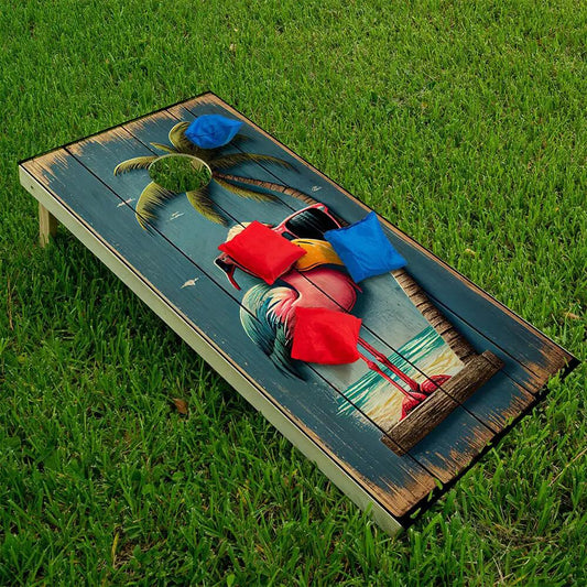 Two-pack cornhole wraps featuring Life's a Beach Flamingo design on weathered blue planked board on Tampa Home & Garden Store