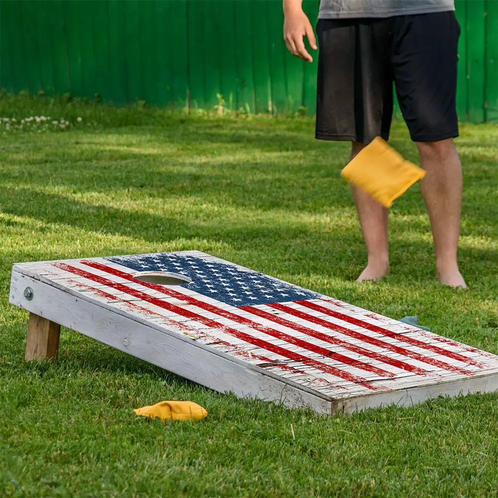 Cornhole wrap set of 2 with cracked wood flag design on weathered white boards on Tampa Home & Garden Store