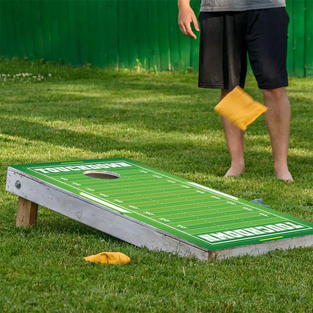 Cornhole wrap set of 2 with football field design in green by Lone Star Art on Tampa Home & Garden Store