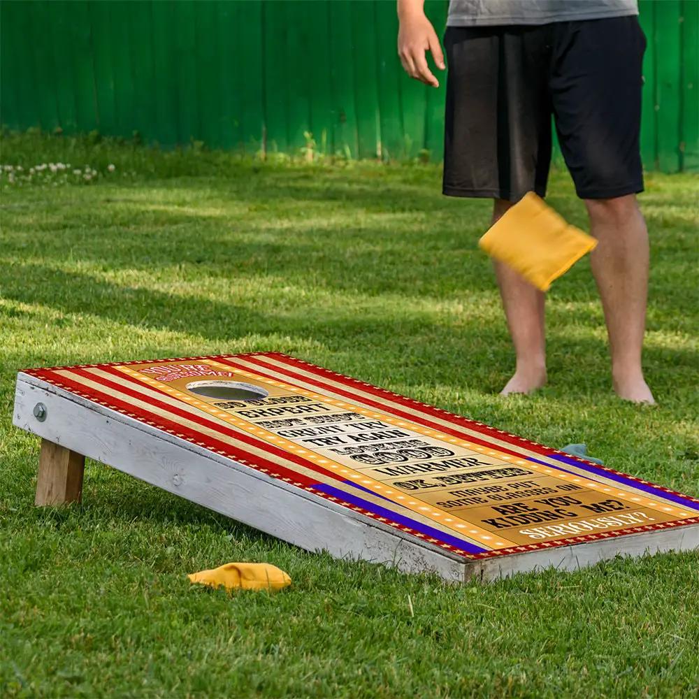 Circus Game Cornhole Board Wrap Set of 2 with red striped sides and gold panel on grass on Tampa Home & Garden Store