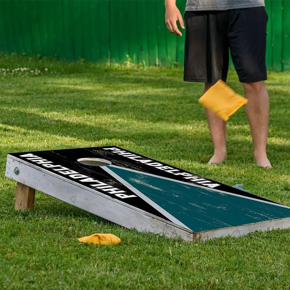 Cornhole board wrap Philadelphia Football by Lone Star Art with black surface and teal stripe on Tampa Home & Garden Store