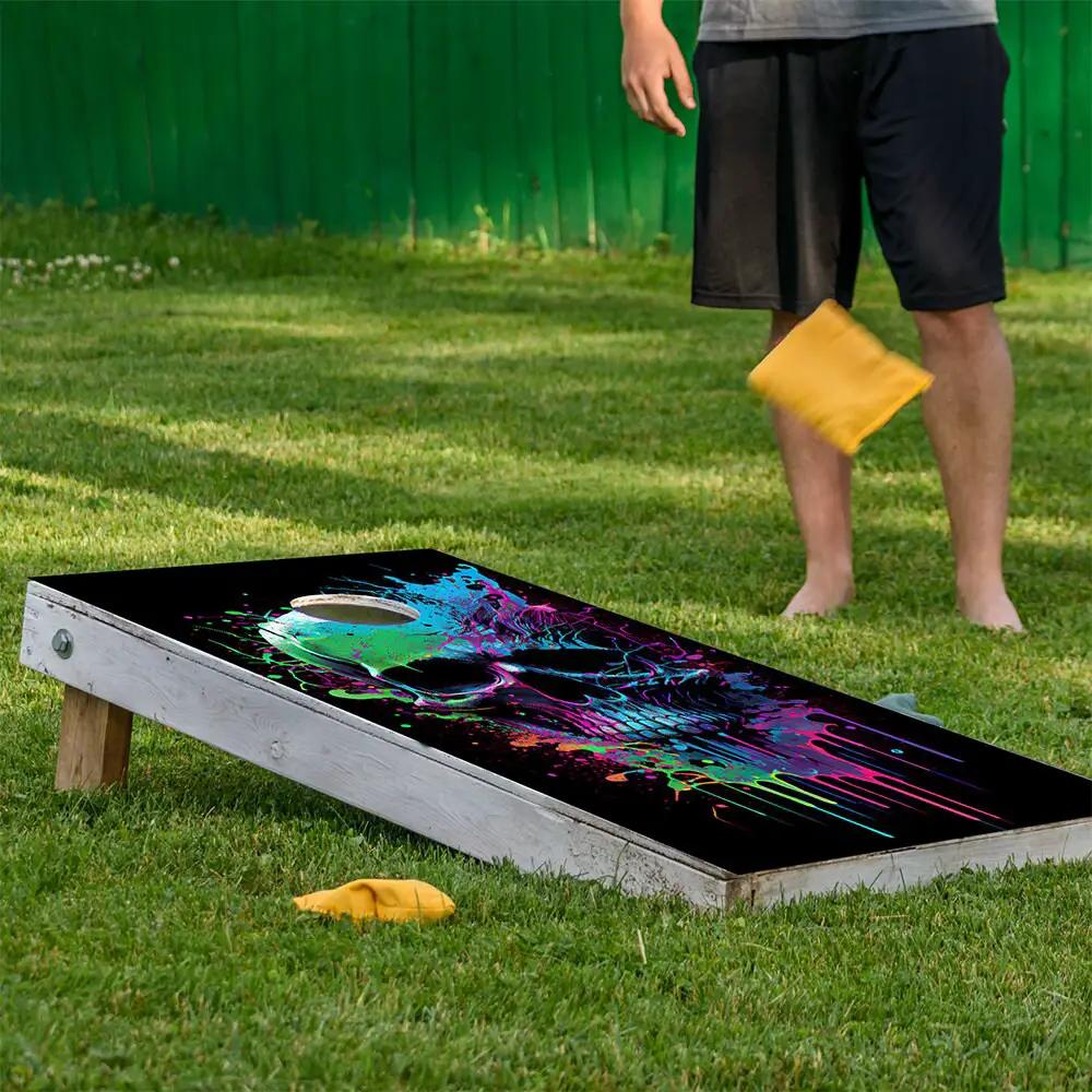 Cornhole board wrap Neon splatter skull design with neon colors on black surface on Tampa Home & Garden Store