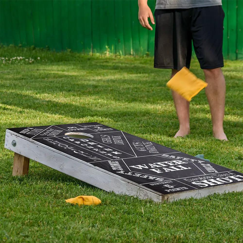 Chalkboard drinking-game cornhole board wrap set of 2 vinyl panels on grass on Tampa Home & Garden Store