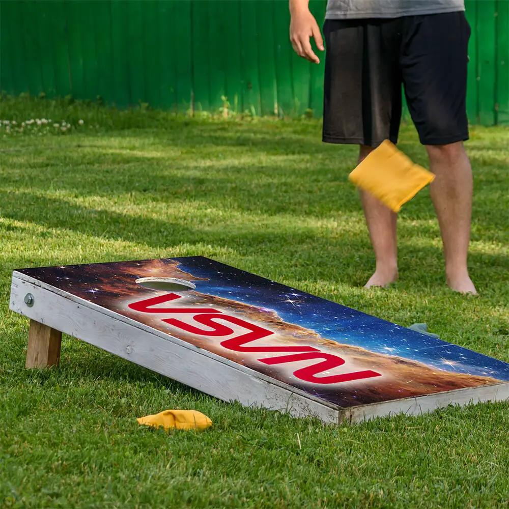 Outer Space Cornhole Wraps Set of 2 on wooden boards with NASA red logo and background on Tampa Home & Garden Store
