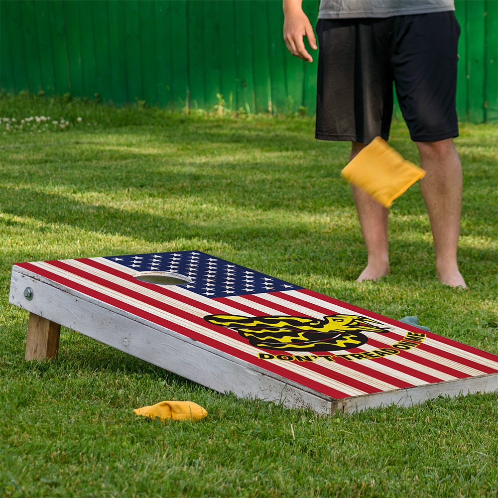 Cornhole board wrap Lone Star Art with American flag design and yellow rattlesnake graphic on Tampa Home & Garden Store