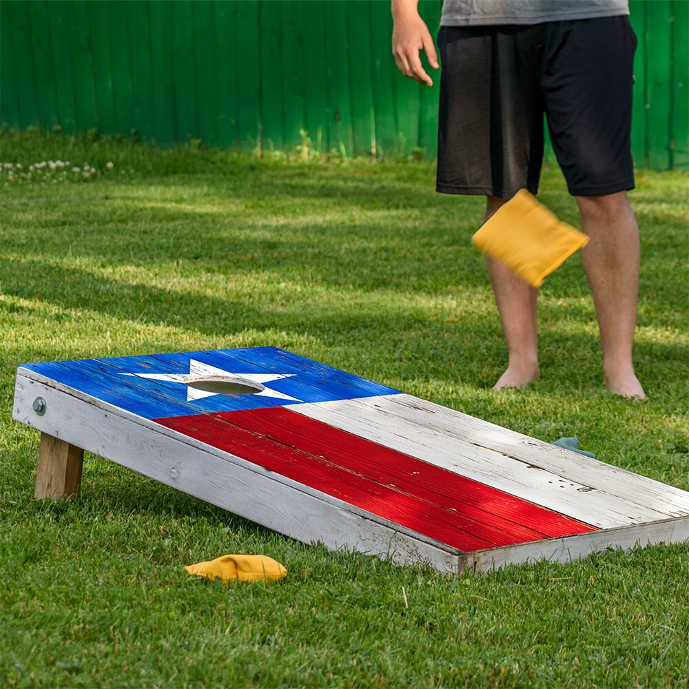 Texas Flag Cornhole Board Wrap on weathered wood board with blue field and white star on Tampa Home & Garden Store