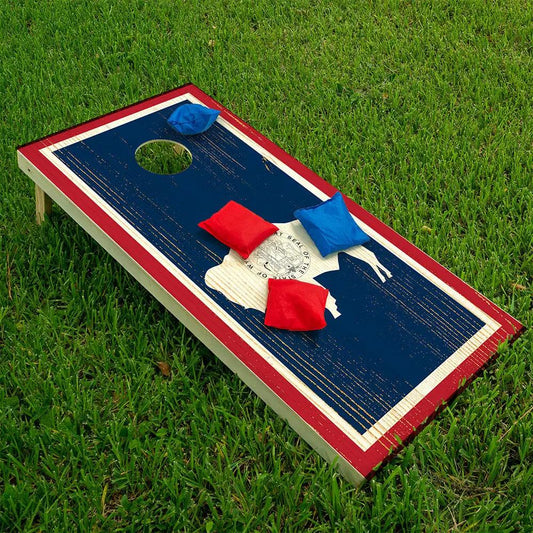 Wyoming state cornhole wrap set of 2 on blue boards with red border and white trim on grass on Tampa Home & Garden Store