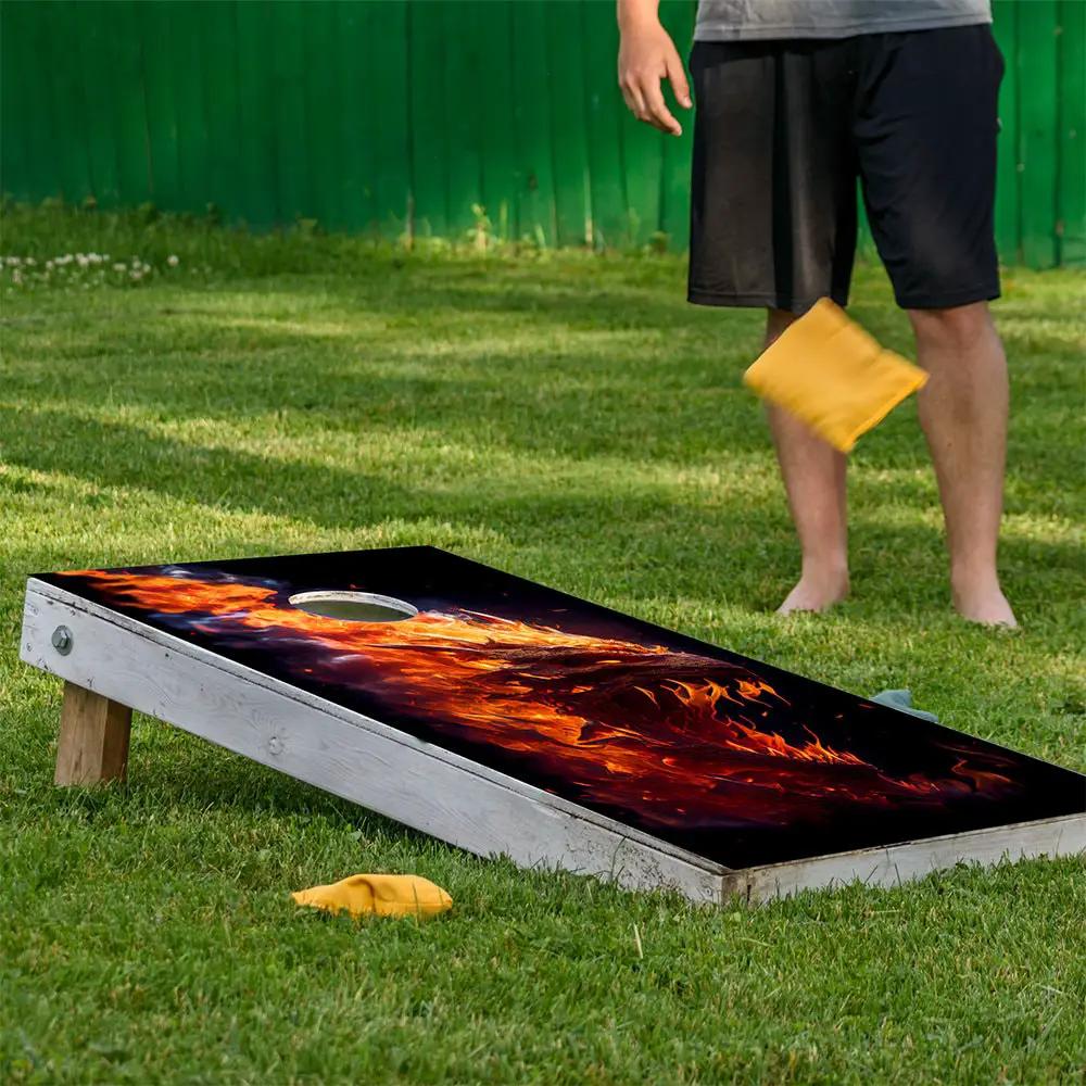 Dragons of Fire Cornhole Board Wraps Set on a weathered wooden board with fiery flame design on Tampa Home & Garden Store