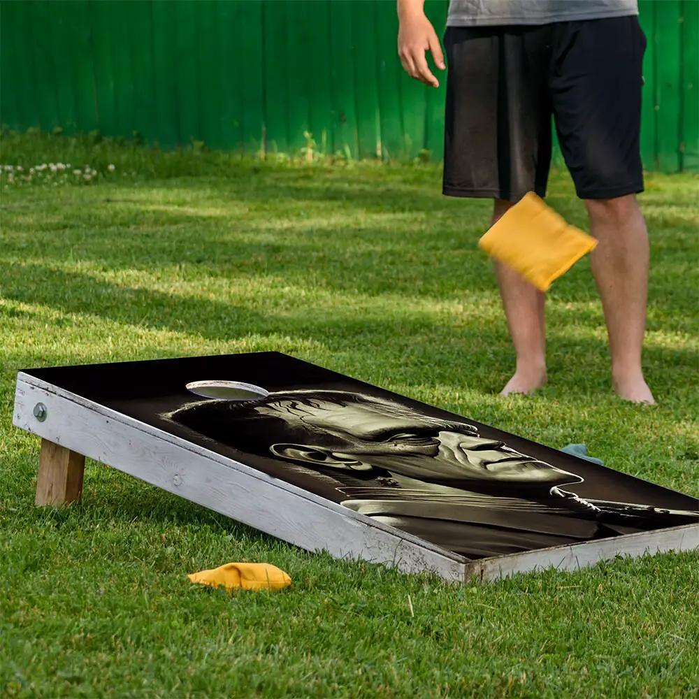 Frankenstein vs Dracula cornhole wrap by Lone Star Art, grayscale monster artwork on white board on Tampa Home & Garden Store