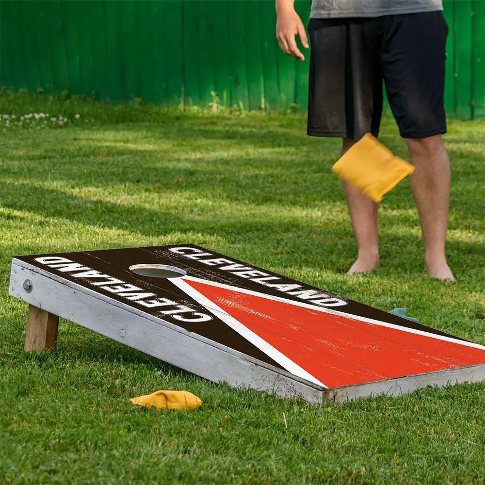Cornhole wrap set of 2 Cleveland Football design by Lone Star Art on black with red stripe on Tampa Home & Garden Store