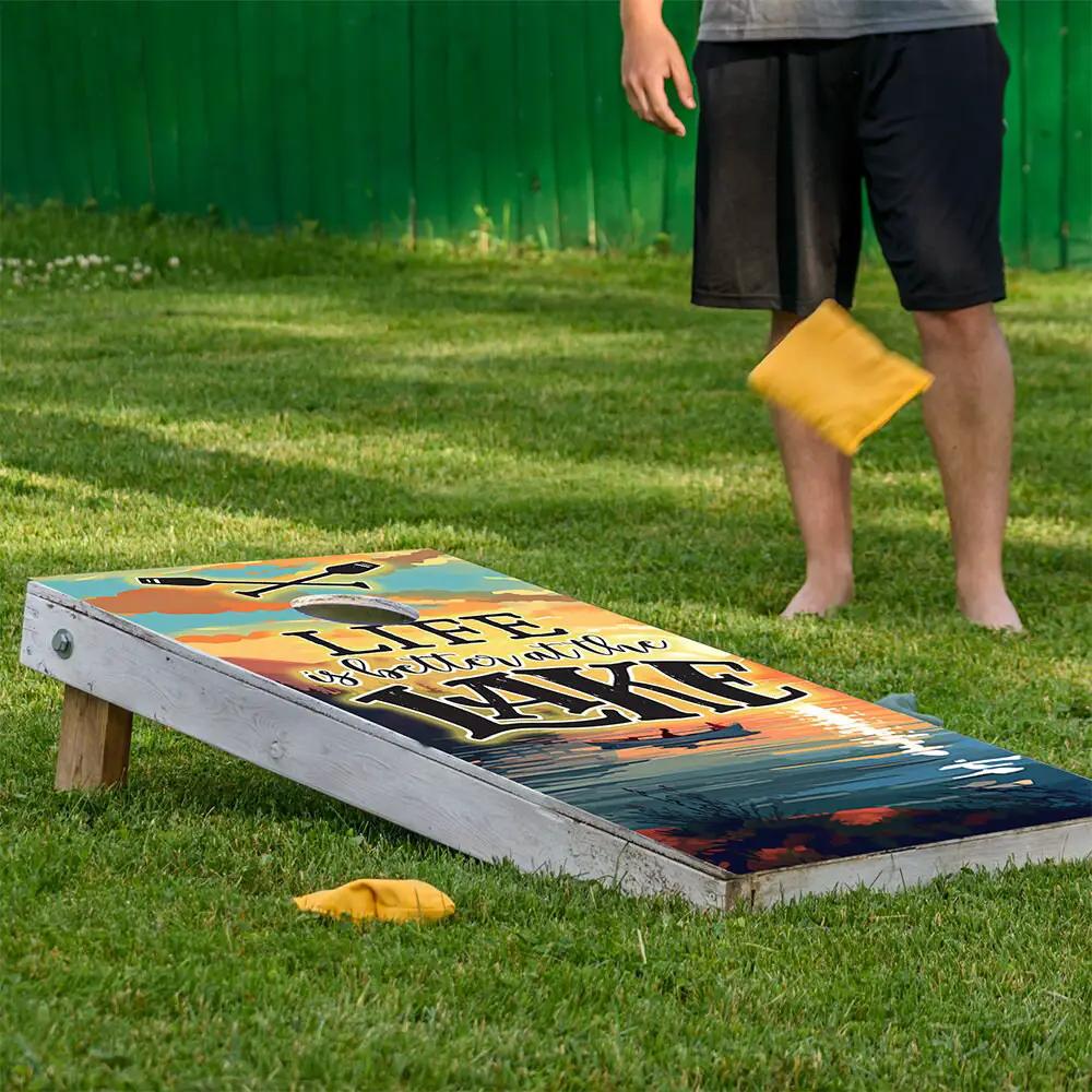Cornhole wrap set of 2 Life Is Better At Lake on weathered board with sunset lake colors on Tampa Home & Garden Store