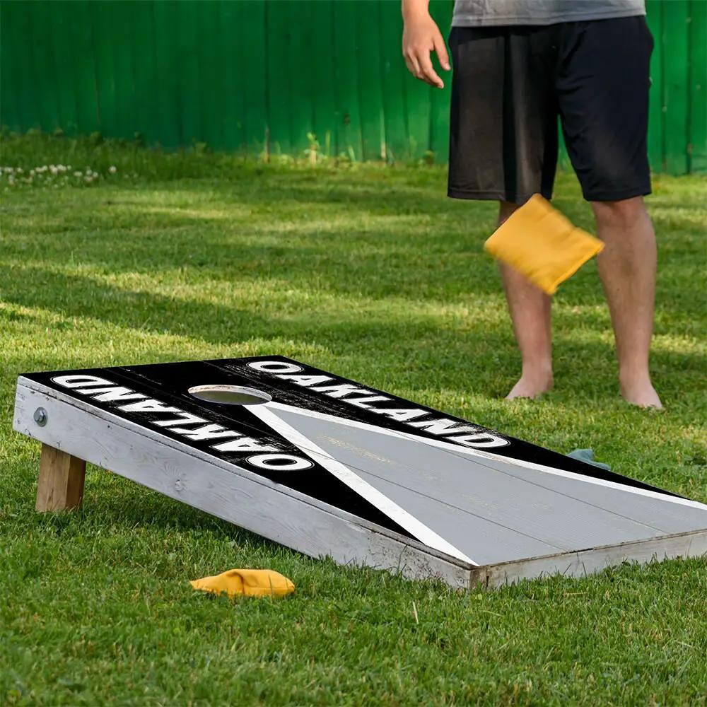 Oakland Football Cornhole Board Wraps set of two, black with white Oakland text by Lone Star Art on Tampa Home & Garden Store