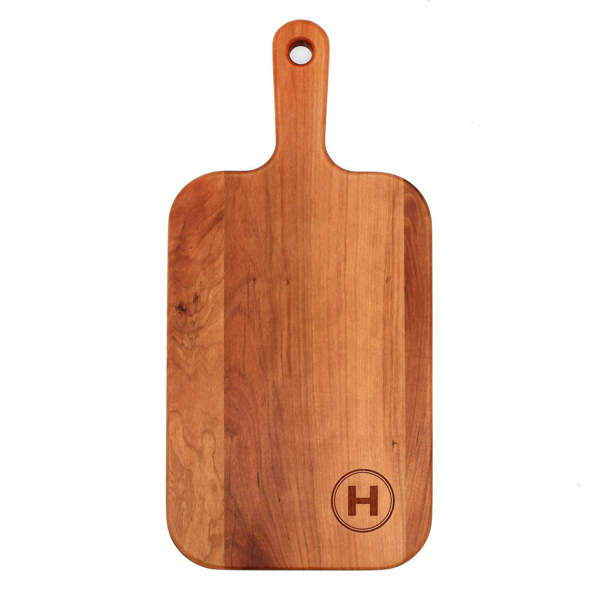 Personalized last name letter charcuterie board in cherry wood with monogram H on paddle board by Refine Kitchenware on Tampa Home & Garden Store