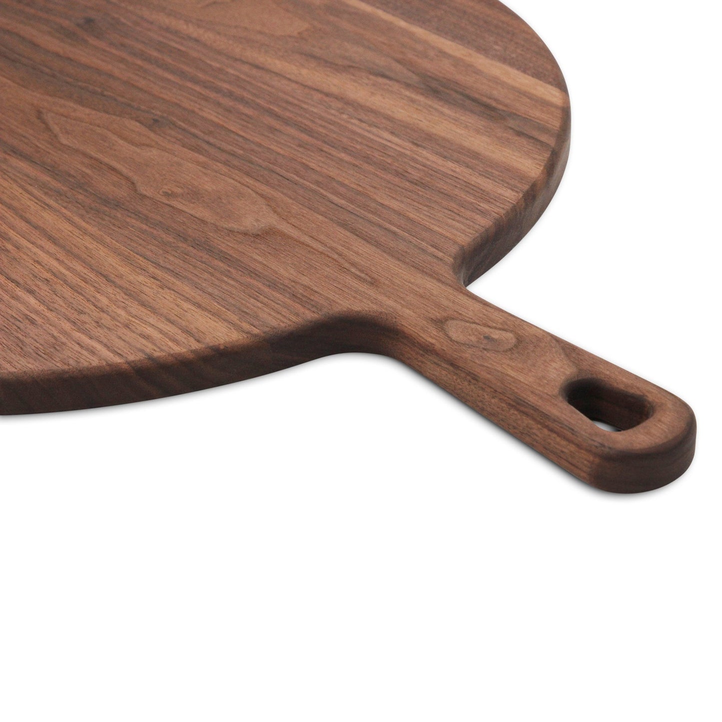 Walnut paddle cutting board with handle, dark wood grain, handmade in USA by Refine Kitchenware on Tampa Home & Garden Store