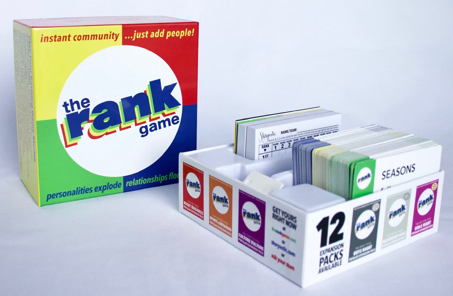 The Rank Game Special Edition Cards box with rainbow cover and expansion packs in a white tray on Tampa Home & Garden Store