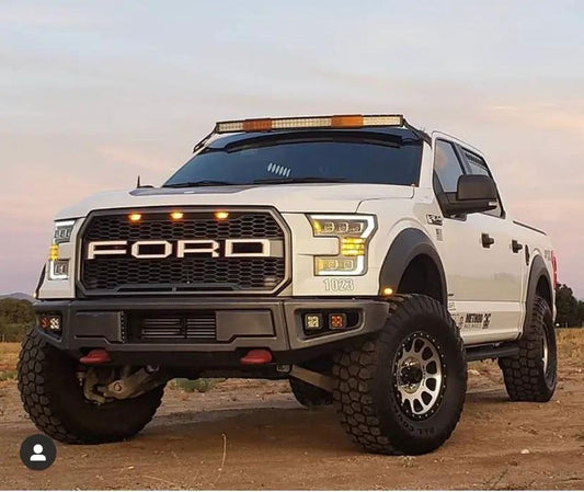 2009 Ford F-150 50 Inch Curved Roof Mounts on white lifted pickup with large off-road tires on Tampa Home & Garden Store