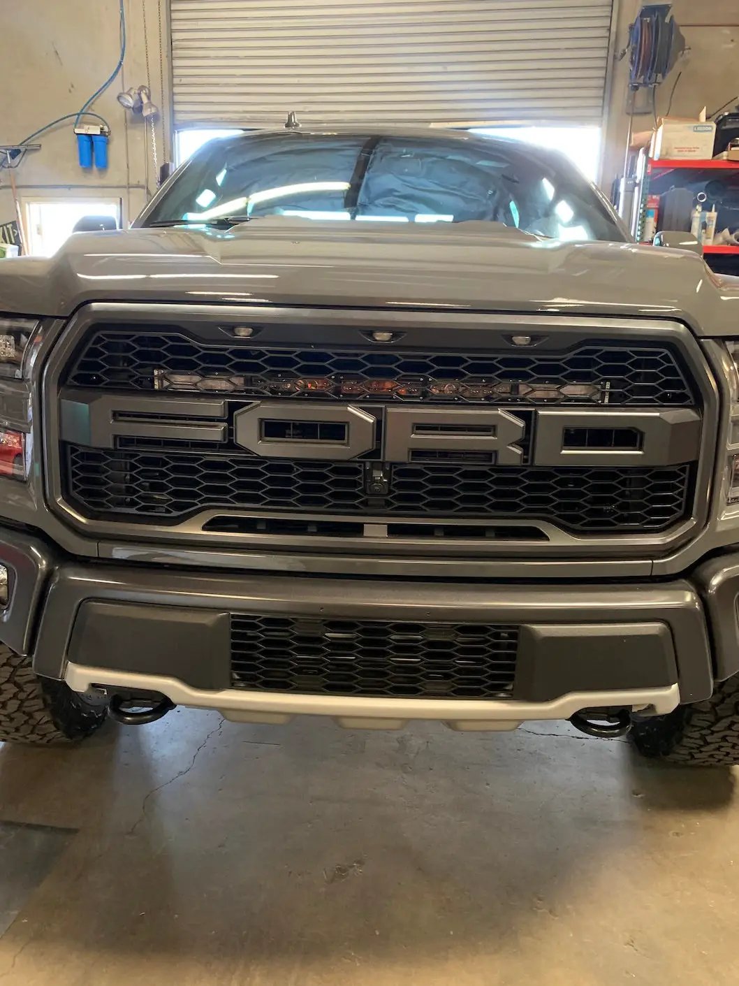 Second Gen Ford Raptor 30-inch behind-grill light bar mount on gray front grille on Tampa Home & Garden Store