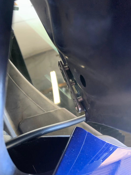 Universal clamp-on ditch light bracket by GGLighting mounted to blue vehicle body on Tampa Home & Garden Store