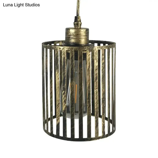 Vintage metal pendant lamp with brass cage shade and exposed bulb on Tampa Home & Garden Store