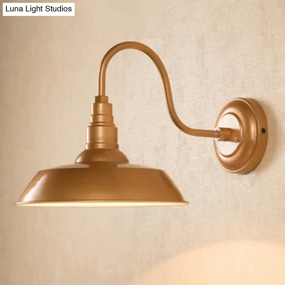 Black metal shade wall sconce with curved bronze arm and round wall mount Decorbites on Tampa Home & Garden Store