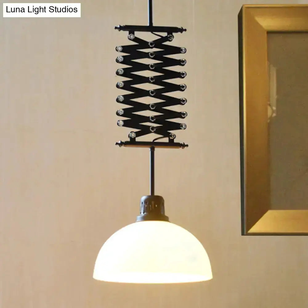 Industrial pendant light with black metal scissor lift and white glass dome shade on Tampa Home & Garden Store