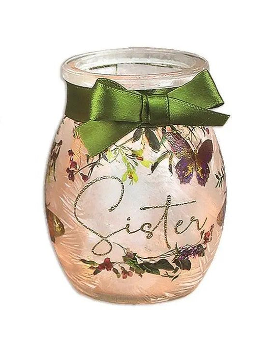 Prelit glass jar lamp with pink tint, floral vine pattern, and green satin bow on Tampa Home & Garden Store