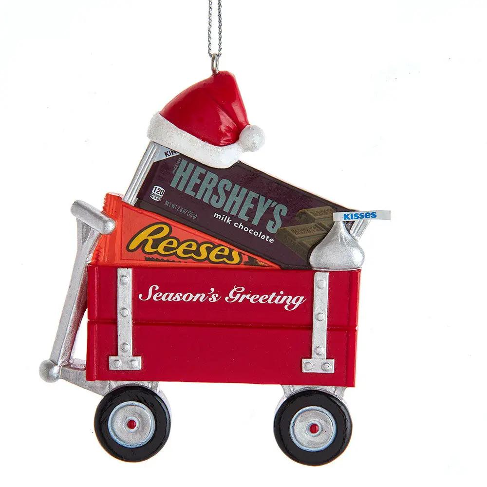 Resin Hershey's wagon ornament with Santa hat on a red wagon with Hershey's Reese's chocolates on Tampa Home & Garden Store