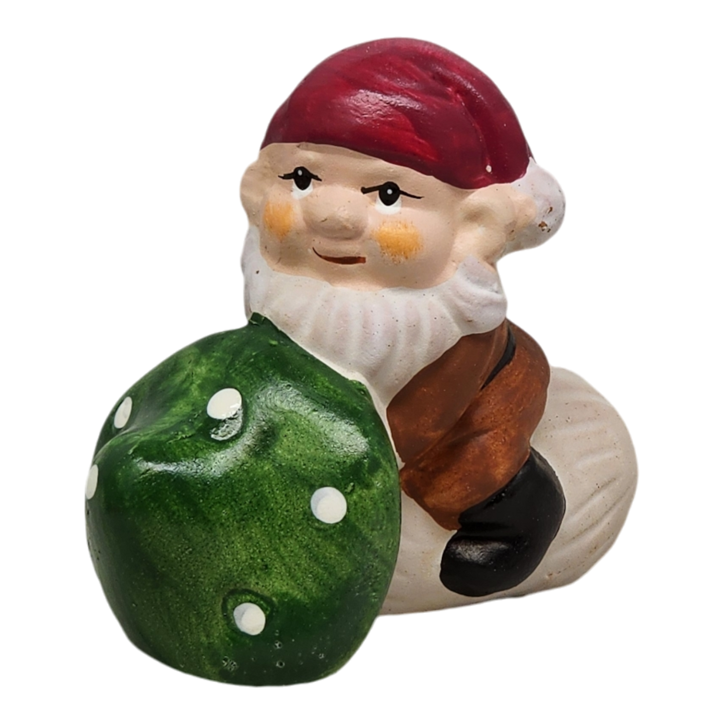 Terracotta gnome with red hat, white beard, holding a green mushroom garden decor on Tampa Home & Garden Store