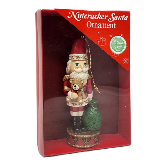 Santa Nutcracker Ornament Handpainted Resin holding teddy bear in red suit on Tampa Home & Garden Store